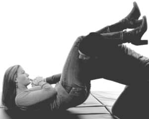 A woman trained in the martial arts using an armbar against a mugger